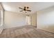 Comfortable main bedroom featuring a ceiling fan and great natural lighting through the window at 7382 Elbridge Way, Las Vegas, NV 89113
