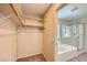 Walk-in closet conveniently located next to the primary bathroom with built-in shelving at 7382 Elbridge Way, Las Vegas, NV 89113