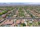 Expansive neighborhood view highlighting desert landscaping, and a home with solar panels, a pool, and inviting curb appeal at 7408 Via Fiorentino St, Las Vegas, NV 89131