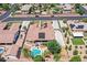Aerial view of a home with solar panels, a private pool and patio, surrounded by mature landscaping and neighboring homes at 7408 Via Fiorentino St, Las Vegas, NV 89131