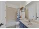Clean bathroom with a combination tub/shower and functional vanity at 7408 Via Fiorentino St, Las Vegas, NV 89131