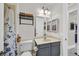 Cozy bathroom features a vanity, toilet, and decorative shower curtain at 7408 Via Fiorentino St, Las Vegas, NV 89131