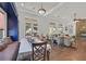 Elegant dining area featuring hardwood floors, backyard views, custom built-ins and easy access to the living room at 7408 Via Fiorentino St, Las Vegas, NV 89131