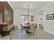 Formal dining area with elegant decor and hardwood floors, perfect for entertaining at 7408 Via Fiorentino St, Las Vegas, NV 89131