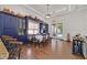 Charming dining area with hardwood floors, custom blue built-ins, recessed lighting and backyard access at 7408 Via Fiorentino St, Las Vegas, NV 89131