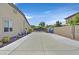 Long driveway leading to the backyard gate, offering ample parking space at 7408 Via Fiorentino St, Las Vegas, NV 89131
