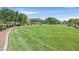 Expansive green space with meticulously manicured grass, offering a tranquil and open environment at 7408 Via Fiorentino St, Las Vegas, NV 89131