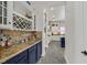 View of open concept kitchen with wine rack, granite countertops, and stainless steel appliances at 7408 Via Fiorentino St, Las Vegas, NV 89131