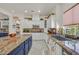 Well-appointed kitchen featuring granite countertops, custom cabinets and modern appliances at 7408 Via Fiorentino St, Las Vegas, NV 89131