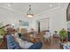 Spacious formal living room with high ceilings, hardwood floors, and lots of light at 7408 Via Fiorentino St, Las Vegas, NV 89131