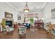 Formal living room features a fireplace, piano, hardwood floors and lots of light at 7408 Via Fiorentino St, Las Vegas, NV 89131