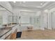 Bright main bathroom suite with soaking tub, glass shower, and dual sink vanity at 7408 Via Fiorentino St, Las Vegas, NV 89131