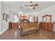Beautiful main bedroom suite with hardwood floors and elegant furnishings at 7408 Via Fiorentino St, Las Vegas, NV 89131