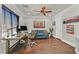 Comfortable office space with hardwood flooring, a ceiling fan, and a serene ambiance at 7408 Via Fiorentino St, Las Vegas, NV 89131