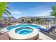 Inviting backyard with a kidney-shaped pool and spa, plus a covered patio for outdoor enjoyment at 7408 Via Fiorentino St, Las Vegas, NV 89131