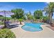 Beautiful backyard pool with lounge chairs and lush landscaping, perfect for relaxing and entertaining at 7408 Via Fiorentino St, Las Vegas, NV 89131