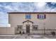 Two story home featuring a symmetrical facade, neutral color scheme, and a covered front entry at 7945 Pandora Sky St # 3, North Las Vegas, NV 89084