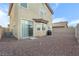 Spacious backyard with rock landscaping, sliding door, and a grill at 8036 Eurostar St, Las Vegas, NV 89131