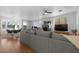 Open-concept living room with fireplace, hardwood floors and modern furnishings at 8036 Eurostar St, Las Vegas, NV 89131