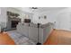 Spacious living room featuring a cozy gray sofa, fireplace and hardwood floors at 8036 Eurostar St, Las Vegas, NV 89131