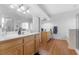 Main bathroom with dual vanity, wood floors, and separate tub and shower at 8036 Eurostar St, Las Vegas, NV 89131