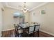 Dining room with a large window and hardwood floors at 8204 Chimney Bluffs St, North Las Vegas, NV 89085