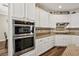 Modern kitchen featuring stainless steel appliances and custom cabinets at 8204 Chimney Bluffs St, North Las Vegas, NV 89085