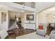 Bright, open-concept living area with hardwood floors and staircase with decorative railing at 8204 Chimney Bluffs St, North Las Vegas, NV 89085