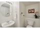 Small, practical bathroom with pedestal sink and updated fixtures at 8224 Fowler Falls Ct, North Las Vegas, NV 89085