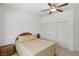 Bedroom featuring a ceiling fan, carpeted floors, and a closet with double doors at 8224 Fowler Falls Ct, North Las Vegas, NV 89085