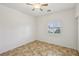Bedroom featuring ceiling fan, tile floors, and window with blinds at 8224 Fowler Falls Ct, North Las Vegas, NV 89085