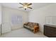 Bright bedroom featuring a ceiling fan, shuttered window, and neutral decor at 8224 Fowler Falls Ct, North Las Vegas, NV 89085