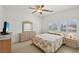 Bedroom features large window, ceiling fan, carpet, and traditional furniture at 8224 Fowler Falls Ct, North Las Vegas, NV 89085