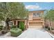 Charming two-story home boasts a well-maintained front yard and a spacious two-car garage at 8224 Fowler Falls Ct, North Las Vegas, NV 89085