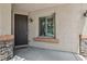 Inviting front entrance with a stylish door, stone accents, and a welcoming ambiance at 8224 Fowler Falls Ct, North Las Vegas, NV 89085