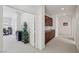 Hallway view with built-in cabinets and an open doorway to a room with a desk at 8224 Fowler Falls Ct, North Las Vegas, NV 89085