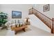 Cozy living room featuring comfortable seating and staircase at 8224 Fowler Falls Ct, North Las Vegas, NV 89085