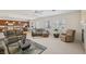 Comfortable living room with plush seating, fireplace, and seamless access to kitchen at 8224 Fowler Falls Ct, North Las Vegas, NV 89085