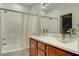 Bathroom featuring double vessel sinks, modern fixtures, and a shower over tub at 8560 Alocasia Ct, Las Vegas, NV 89149