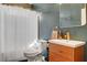 Bathroom with modern fixtures, white shower curtain, vanity with storage, and textured blue accent wall at 8560 Alocasia Ct, Las Vegas, NV 89149