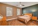Cozy bedroom showcasing two windows with shutters, and an overhead fan at 8560 Alocasia Ct, Las Vegas, NV 89149
