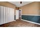 Bedroom featuring a closet and door to another room, with wood look tile flooring throughout at 8560 Alocasia Ct, Las Vegas, NV 89149