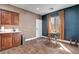 Bright dining area with wood-look tile floors, a breakfast nook, and plenty of natural light at 8560 Alocasia Ct, Las Vegas, NV 89149
