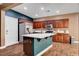 Kitchen featuring a center island, stainless steel appliances, and updated cabinetry at 8560 Alocasia Ct, Las Vegas, NV 89149