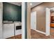 Convenient laundry room adjacent to a hallway with wood look tile flooring at 8560 Alocasia Ct, Las Vegas, NV 89149