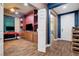 Inviting living room showcasing custom built-ins, wood-look tile flooring, and cozy atmosphere at 8560 Alocasia Ct, Las Vegas, NV 89149