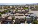 Wide aerial view of a residential neighborhood showcasing homes and green spaces at 9053 Boston Springs Ave, Las Vegas, NV 89149