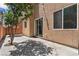 The backyard features a sliding glass door and string lights, perfect for outdoor living at 9053 Boston Springs Ave, Las Vegas, NV 89149
