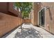 Private backyard featuring a concrete patio, desert landscaping, and string lights for outdoor relaxation and entertaining at 9053 Boston Springs Ave, Las Vegas, NV 89149