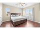 Bedroom with hardwood floors, neutral color palette, ceiling fan, and natural light at 9053 Boston Springs Ave, Las Vegas, NV 89149